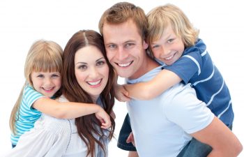 Smiling family on the white background