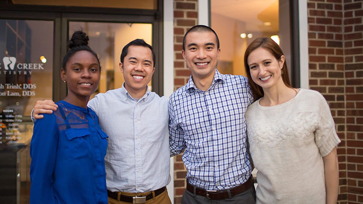 Dr. Lam and Dr. Trinh with two members of their dental team.